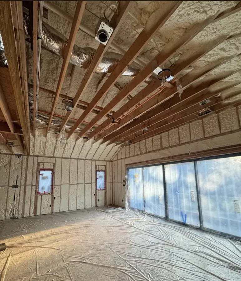 Interior walls and ceiling insulated with spray foam during new construction in Georgetown